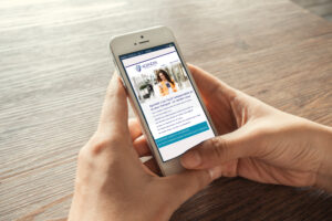 BANGKOK, THAILAND - MAY 15 2016: Young woman touch Facebook icons on Apple iPhone 5s. Facebook is largest and most popular social networking site in the world.